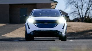 2025 Nissan Ariya Platinum+ AWD headlights turned on.