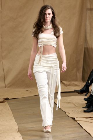 a model on the vettese runway