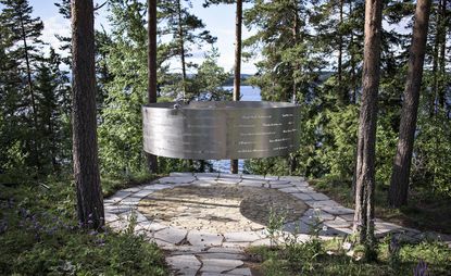 Steel ring elevated above the ground with names carved out of it