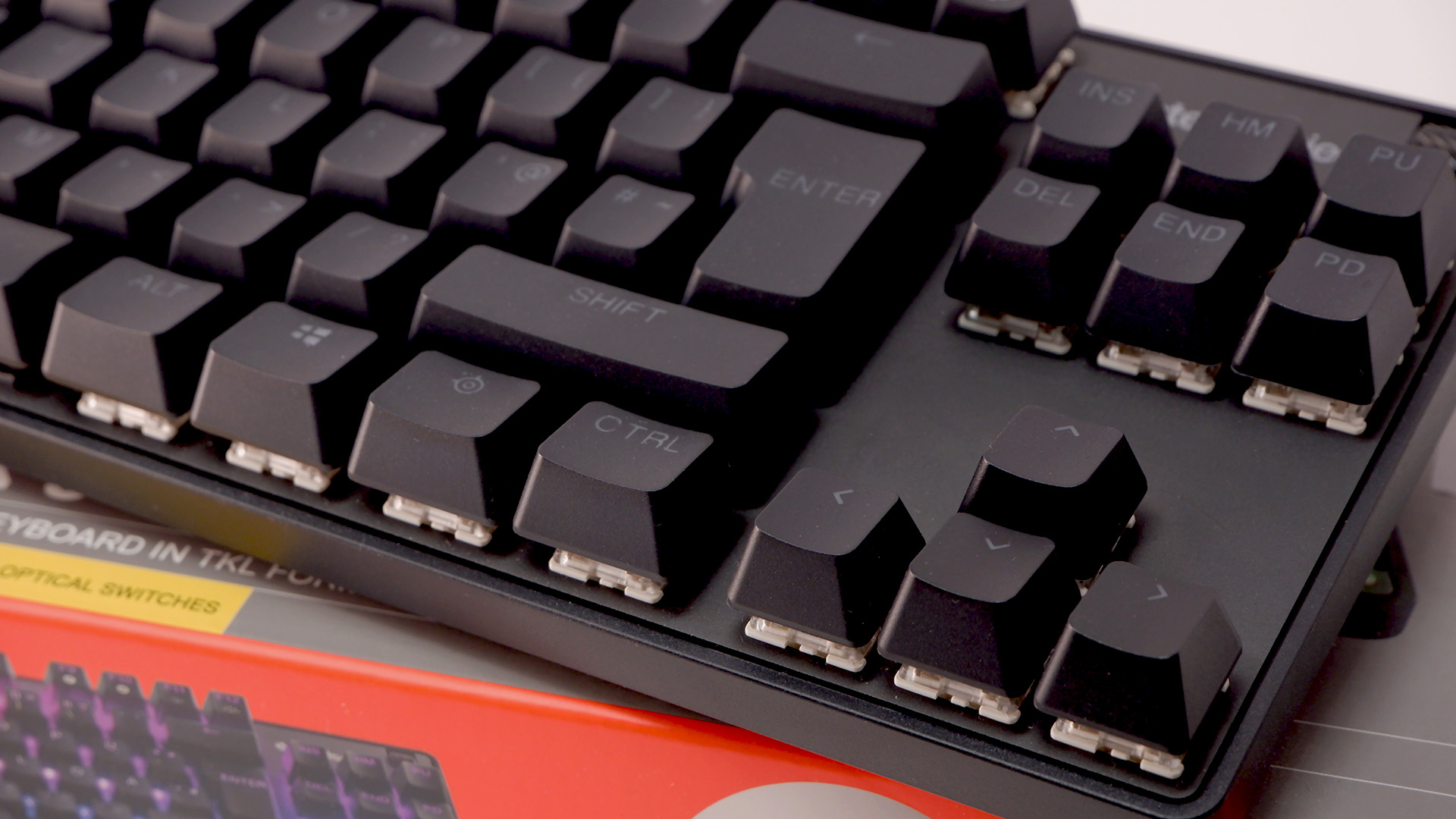 SteelSeries Apex 9 TKL gaming keyboard pictured on its box.