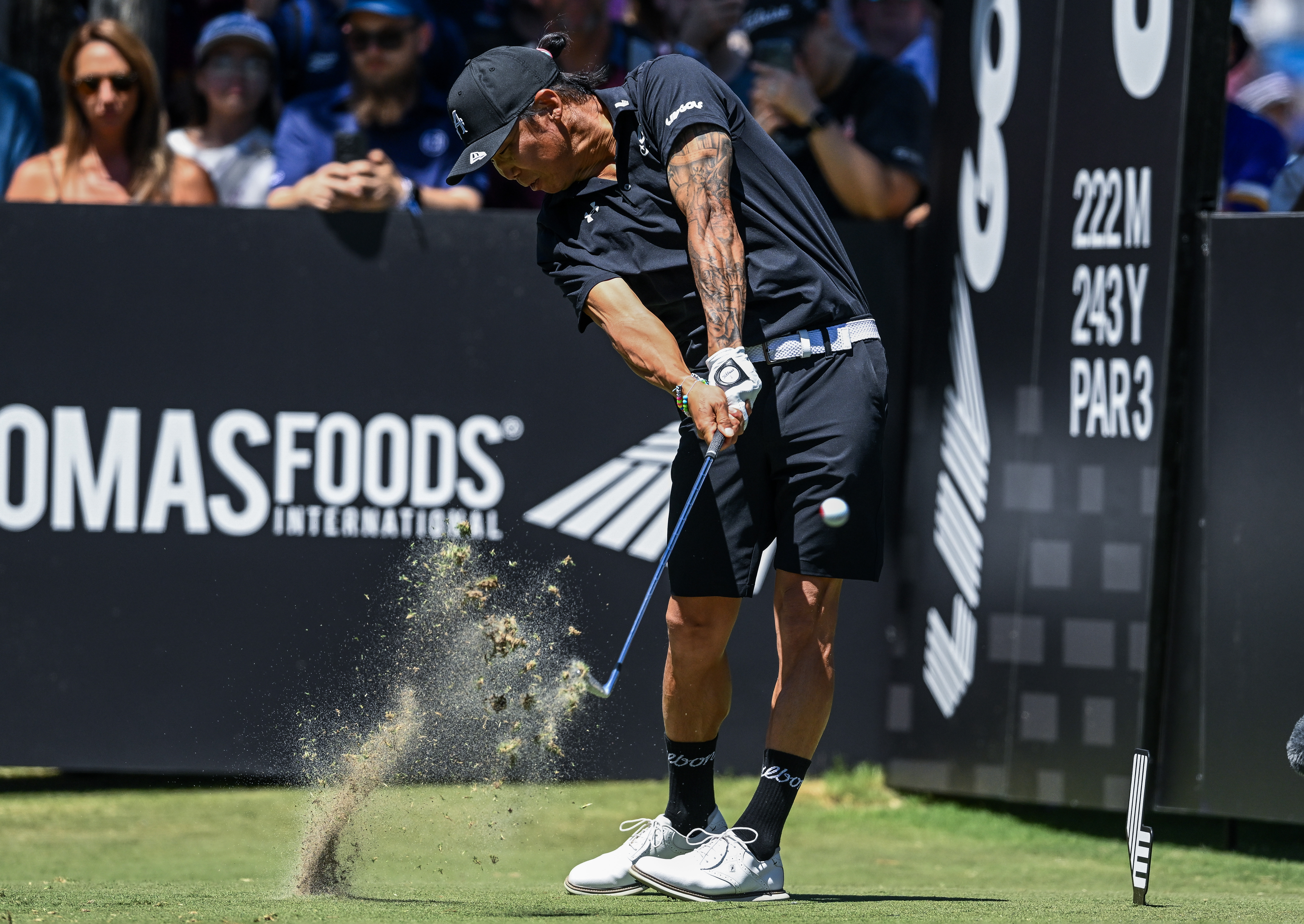 Anthony Kim hits an iron shot off the tee