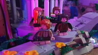 The hobbit minifigures stand amidst the architecture of Lego Rivendell