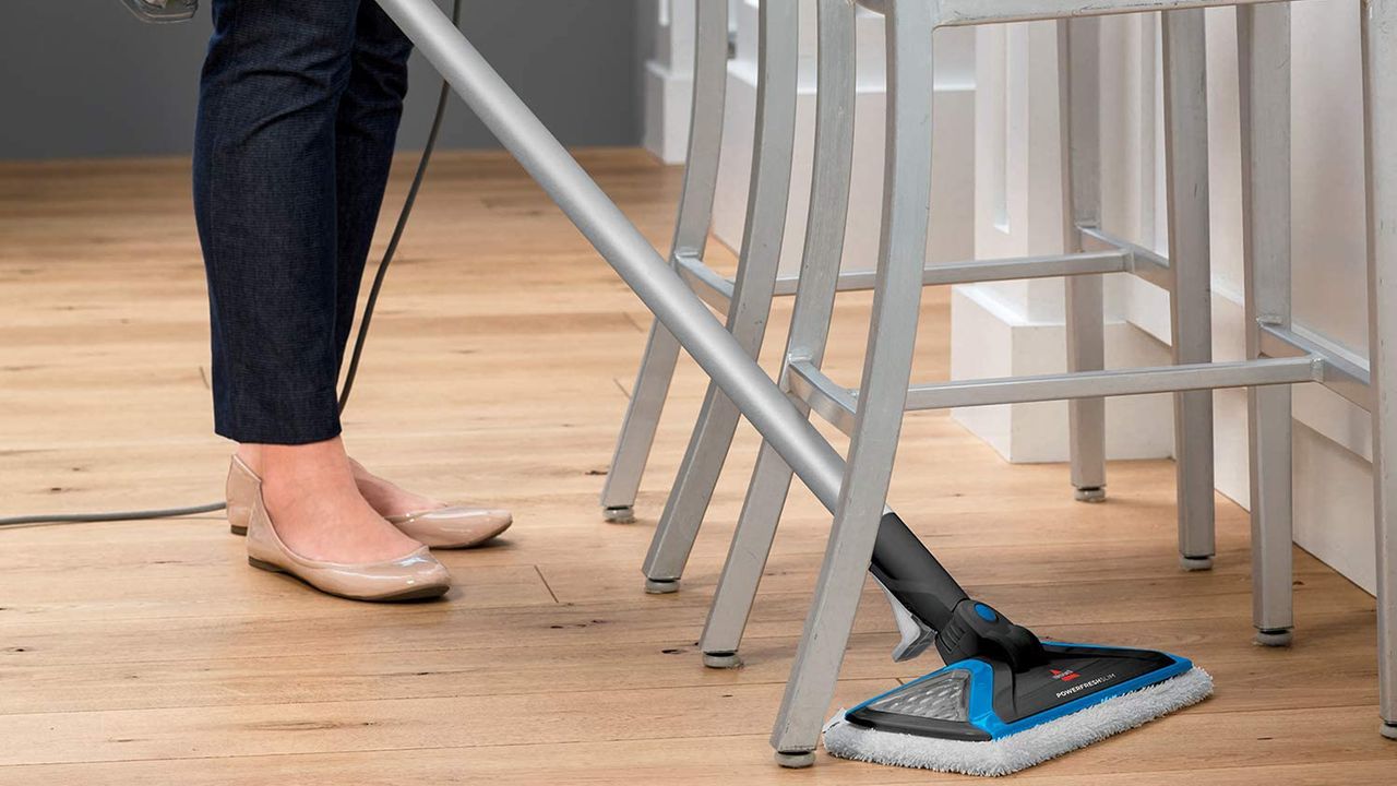 Image of Bissell PowerFresh SlimSteam steam mop cleaner in promotional image being used on hard floors 