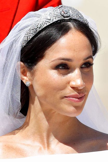 The Queen picks out a bride's wedding tiara.