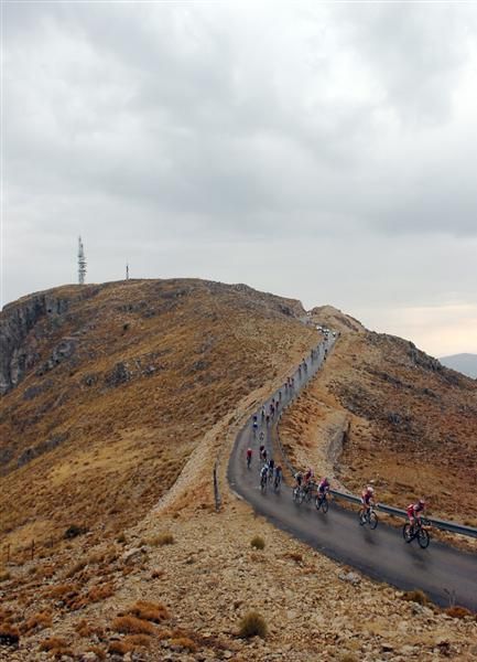 The peloton continue towards the summit of Alto Sierra de la Pandera