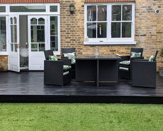 deck painted black with garden dining set