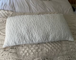 Coop Adjustable Pillow on bed, flat