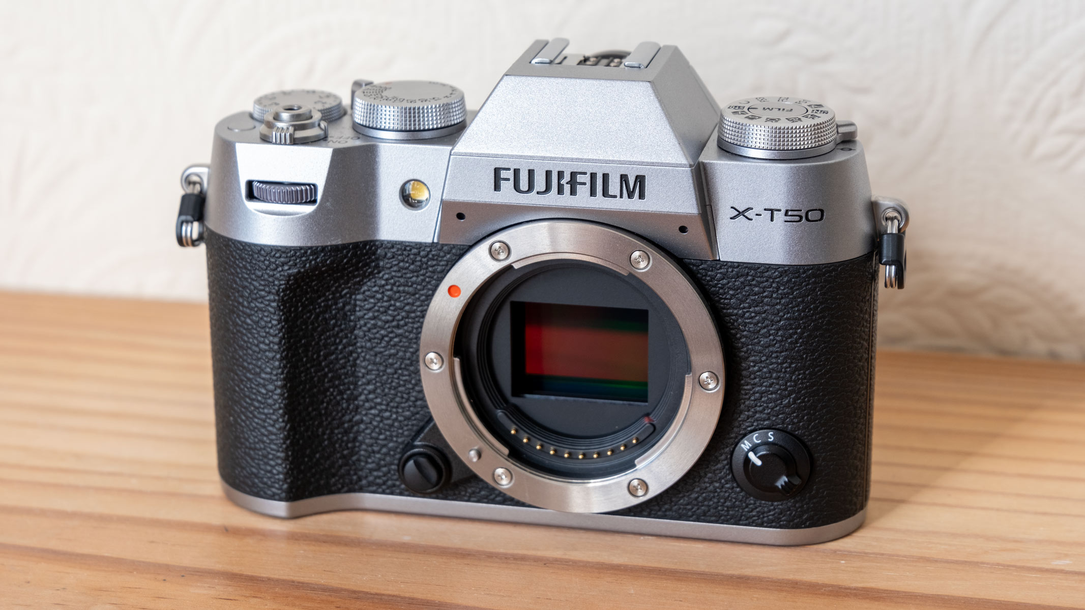 The Fujifilm X-T50 on a wooden bench