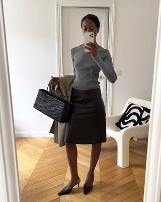 A fashion person wearing a black skirt