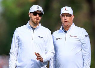 Stewark Cink and his son Connor on the golf course