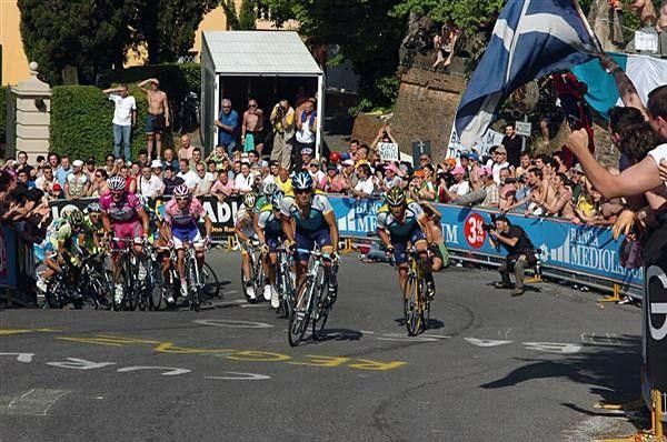 Several Astana riders climb a steep section of the San Luca.