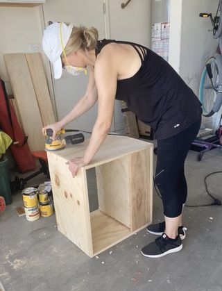 woman building a nightstand