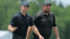 Rory McIlroy of Northern Ireland and Shane Lowry of Ireland wave to fans during the second round of the Zurich Classic of New Orleans at TPC Louisiana on April 26, 2024