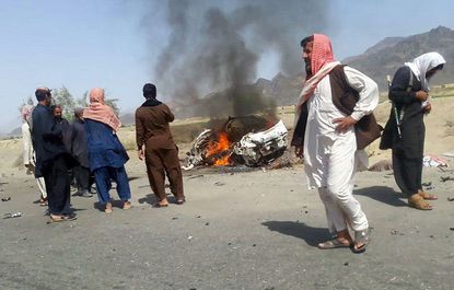 The wreckage of a car carrying late Taliban leader Mullah Mansour