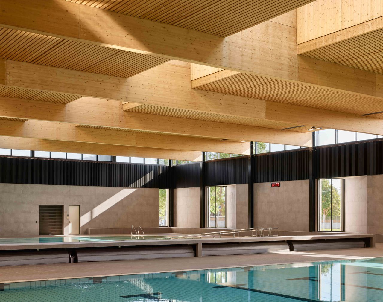 Northcote Aquatic Recreation Centre interior with striking timber roof above swimming pool