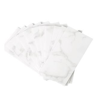 A fanned out pile of marble peel and stick tile