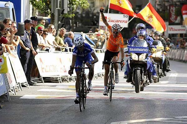 Carlos Barredo stops his clock while Anton celebrates his team's win