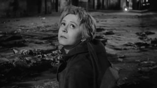 Giulietta Masina looking up teary-eyed in La Strada