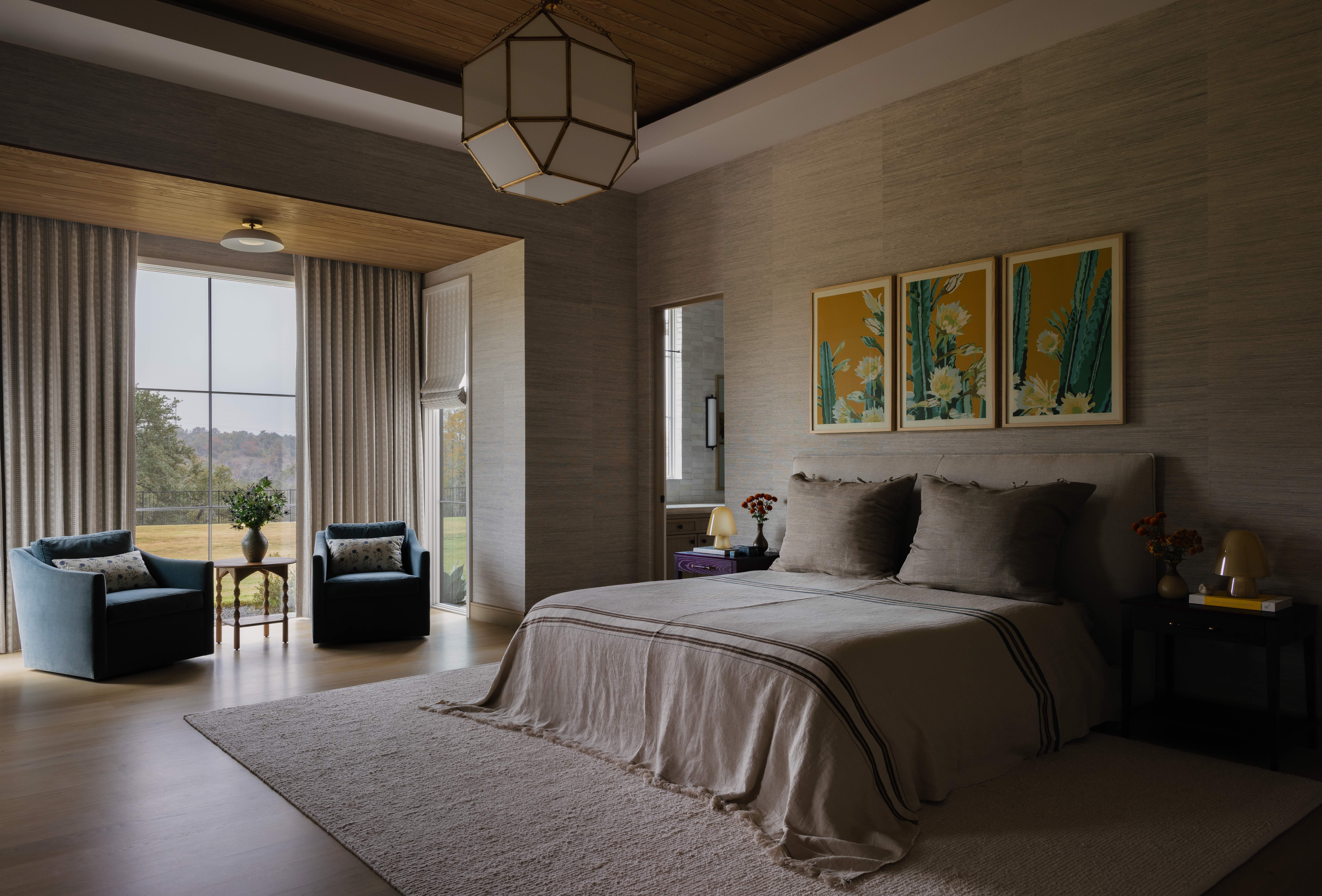 A contemporary bedroom with a reading nook contained within a deep window recess