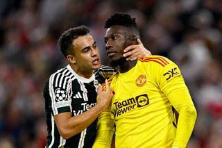 ergio Reguilon and Andre Onana of Manchester United interact during the UEFA Champions League match between FC Bayern München and Manchester United at Allianz Arena on September 20, 2023 in Munich, Germany. (Photo by Daniel Kopatsch - UEFA/UEFA via Getty Images)