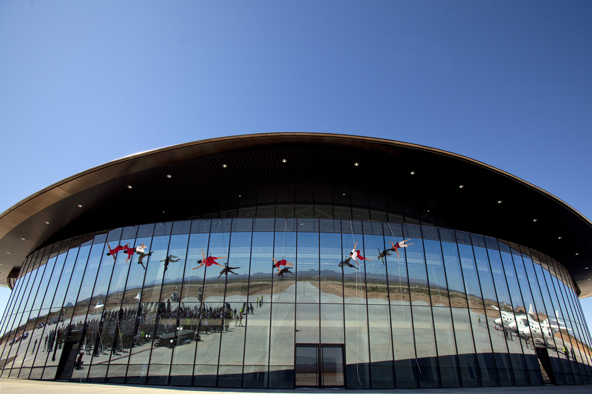 The new Virgin Galactic Terminal Hangar Facility at New Mexico&#039;s Spaceport America was dedicated October 17. Ceremonies included aerialists doing their own form of &quot;space walking&quot; - across the building&#039;s face. 