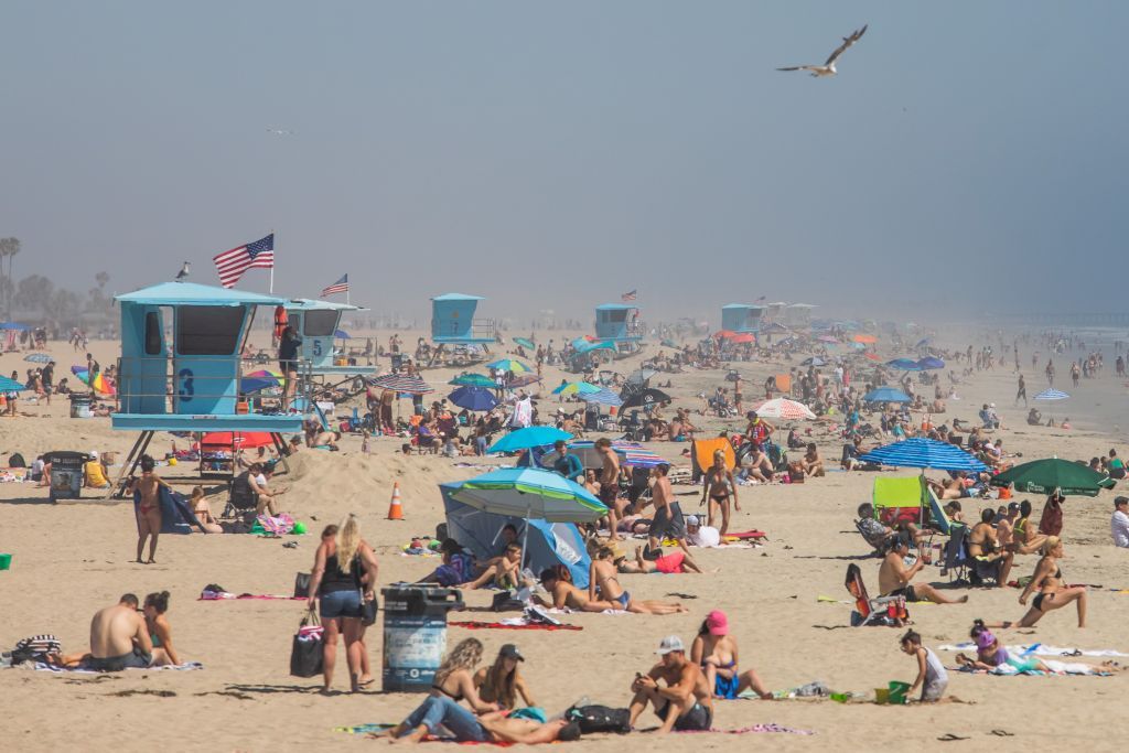 People at Huntington Beach on April 25.