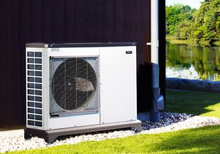 Nibe F2040 air source heat pump on side of house