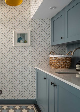 blue laundry room with blue and orange small format wallpaper