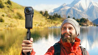 Man using Insta360 ONE RS 1-inch 360 Edition action camera in mountainous landscape
