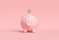 Pink piggy with dollar coin