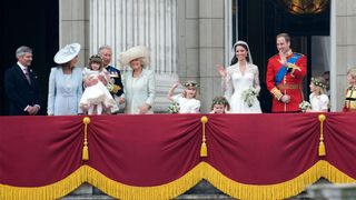 L-R) Michael Middleton, Carole Middleton, Eliza Lopes, King Charles III, Queen Camilla and Lady Louise Windsor, Grace Van Cutsem, Prince William, Prince of Wales and Catherine, Princess of Wales stand on the balcony of Buckingham Palace at Westminster Abbey on April 29, 2011