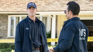 Austin Stowell and Kyle Schmid on NCIS: Origins crime scene set