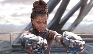 Black Panther Shuri aims her gauntlets at the threat