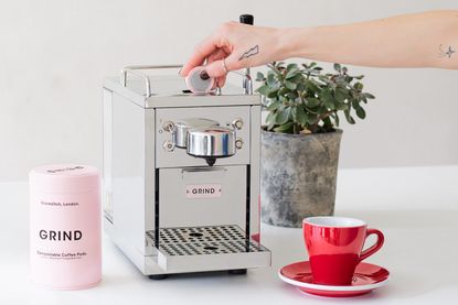 the Grind coffee machine on a white marble surface, one of the best coffee machine picks