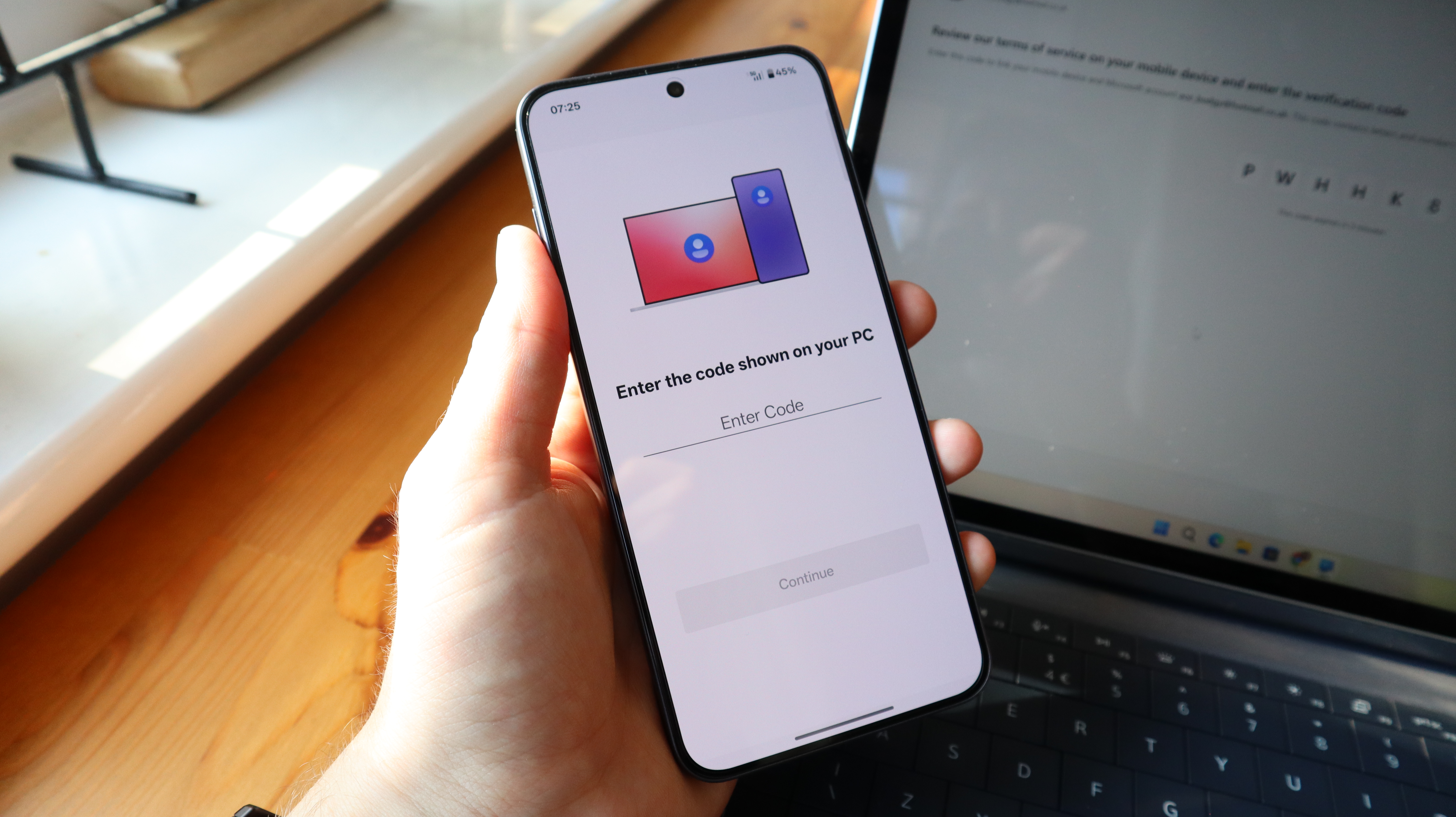 An Android user connecting his phone to a Windows PC