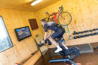 Image shows a person using ERG mode in Zwift