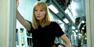 Pepper Potts with Iron Man's helmet under her arm
