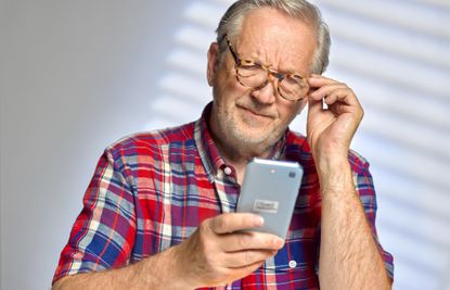 man looking confused at his phone
