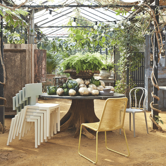 outdoor table with chairs and bulb lighting arrangements