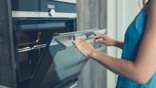 Best electric double wall ovens | image showing an oven door being opened