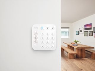 white Ring alarm in a modern flat with white walls
