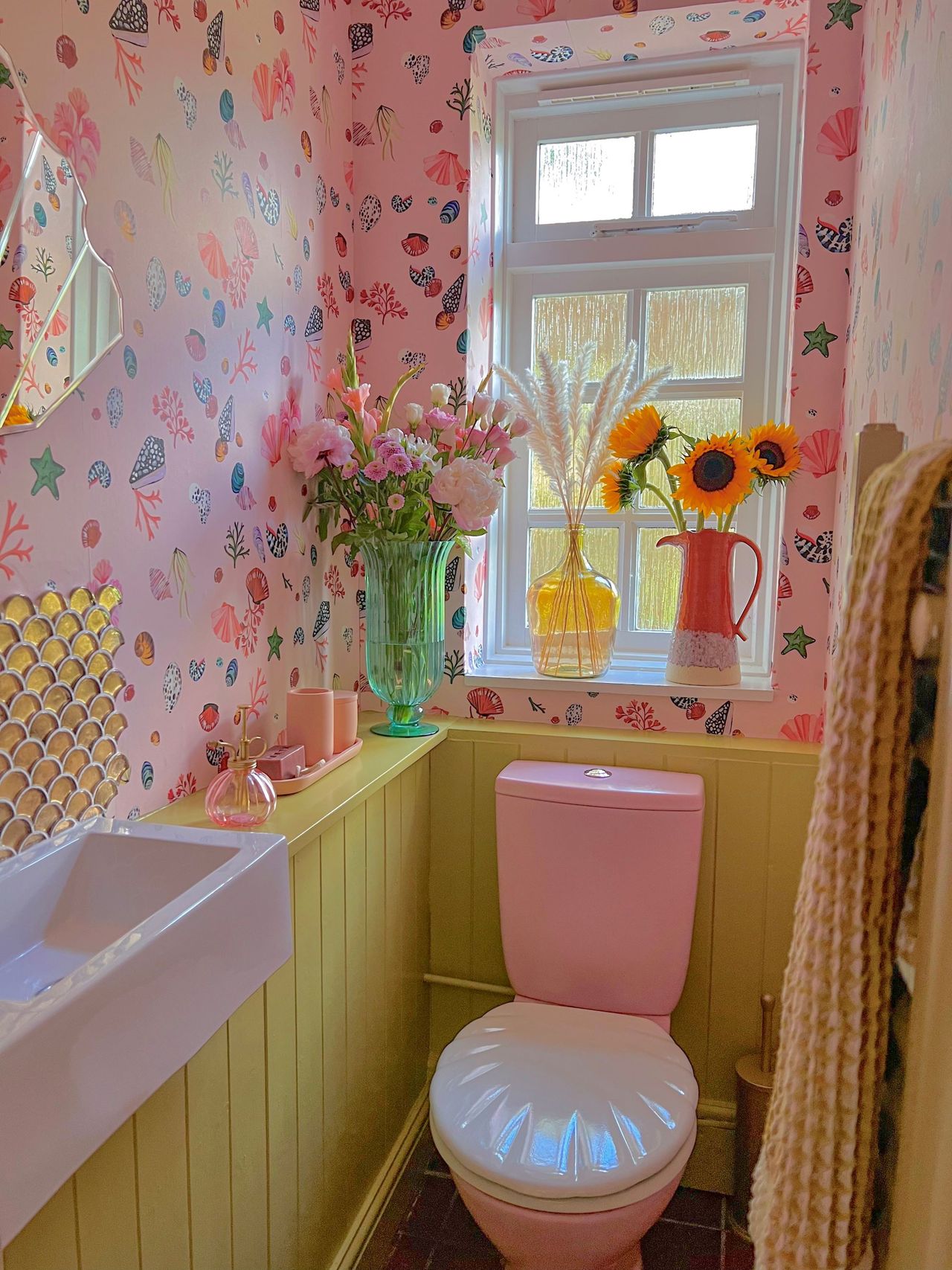 Upstairs toilet with pink walls and features