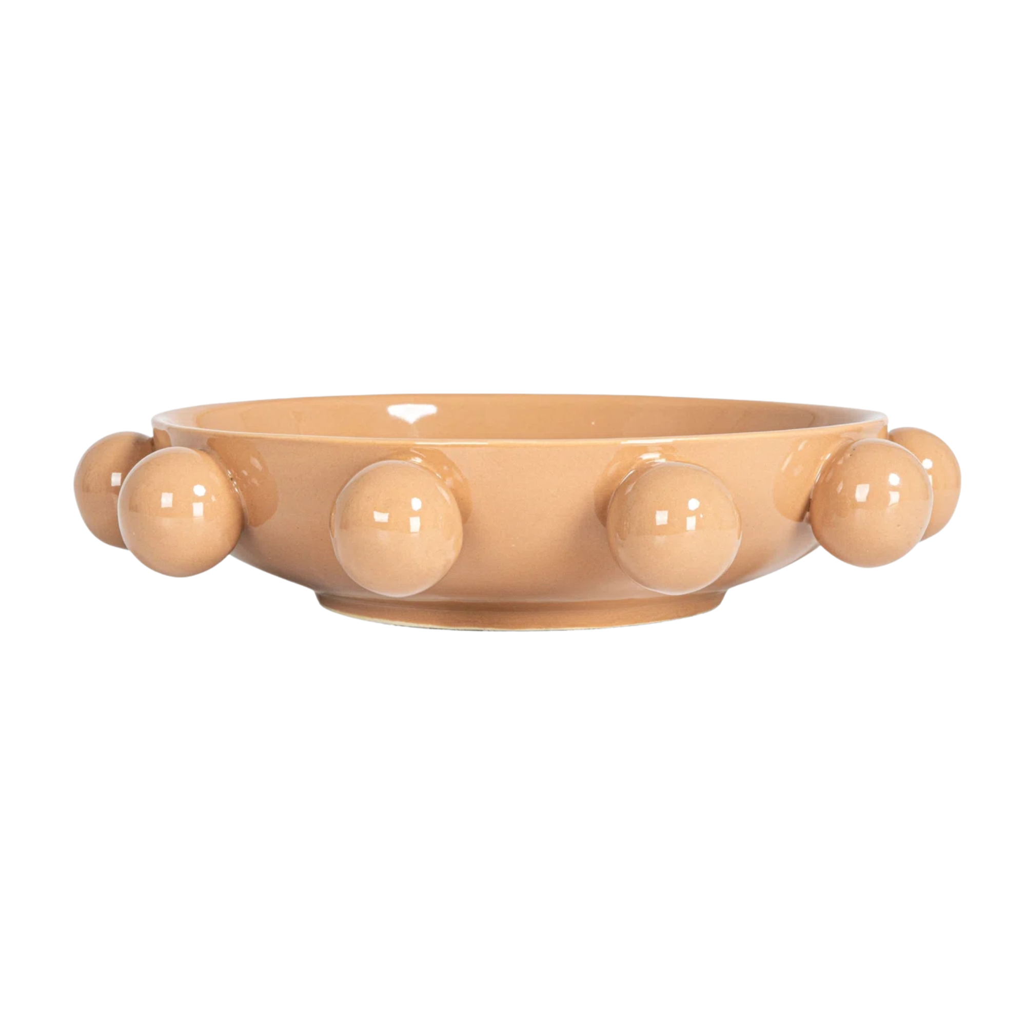 a coral colored decorative bowl with round details on the exterior 
