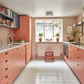 peach kitchen with red stool