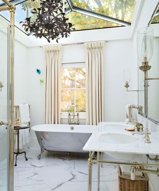 Parisian bathroom decor with skylight and chandelier