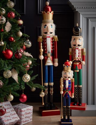 room with christmas tree gift boxes and wooden nutcracker decorations