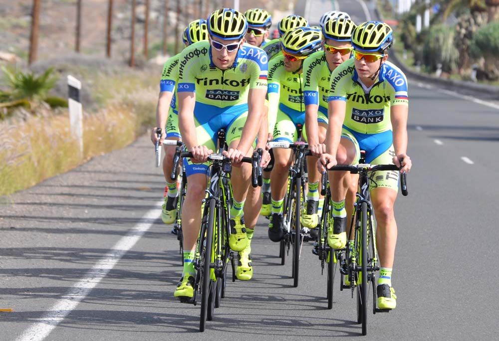 The riders tuck tightly in a double line