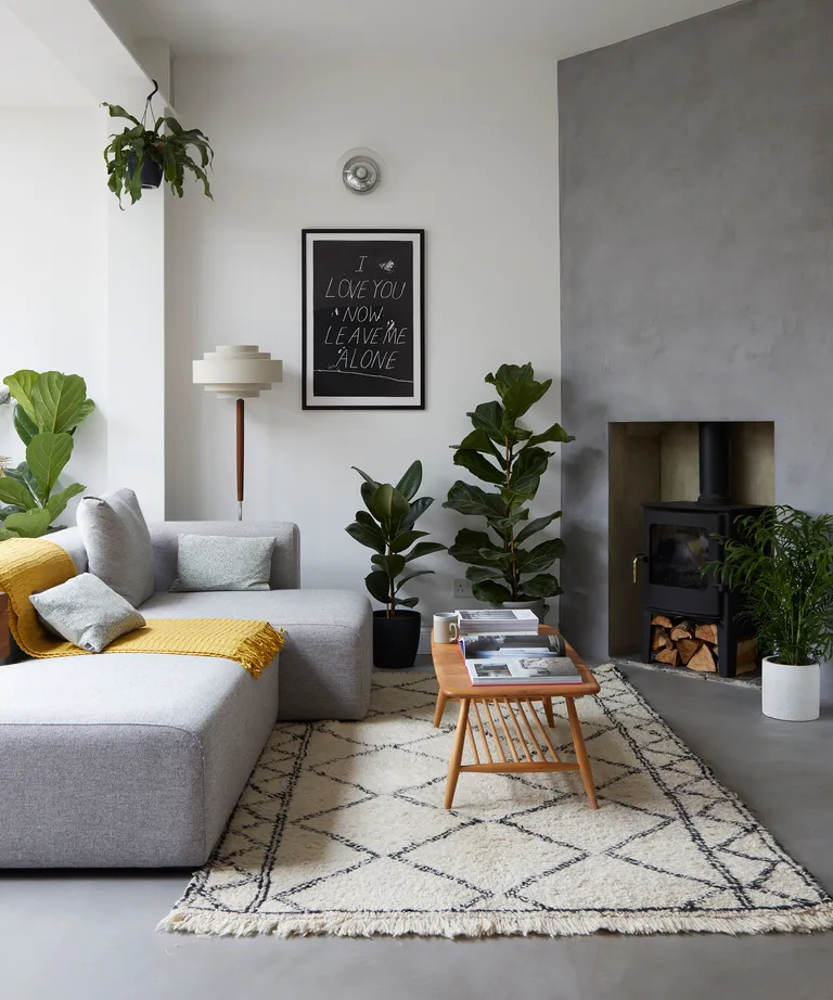 Mid-century modern living room with grey walls and wood furniture