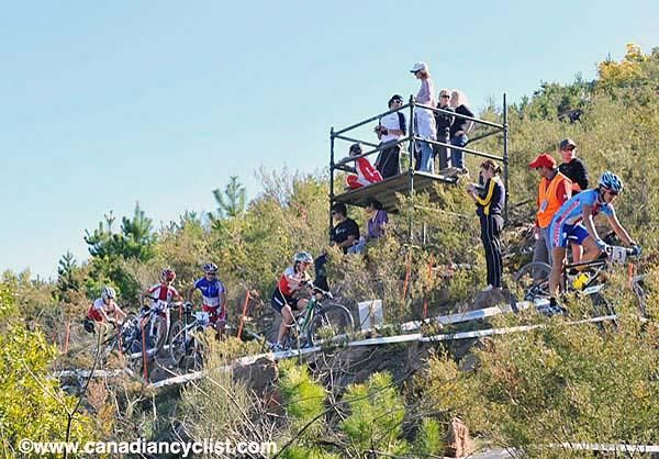 Spectators use a platform for a better view.