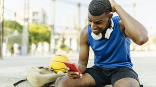 Man checking phone after workout